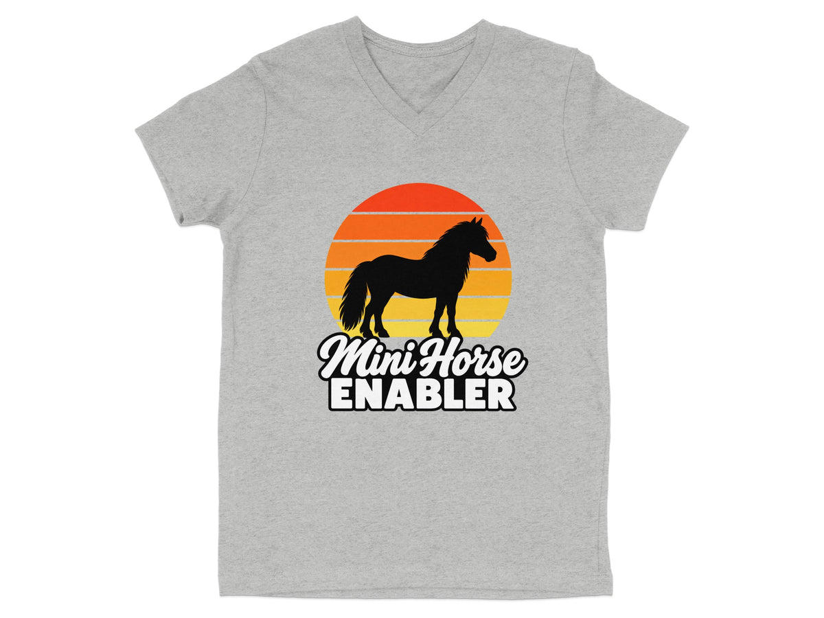 Heather gray V-neck t-shirt featuring a silhouette of a mini horse against a retro sunset graphic with the text MINI HORSE ENABLER.