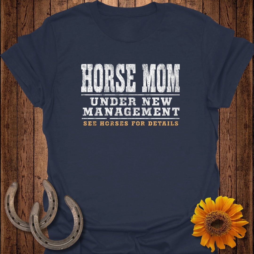 Navy t-shirt with "HORSE MOM UNDER NEW MANAGEMENT SEE HORSES FOR DETAILS" text.