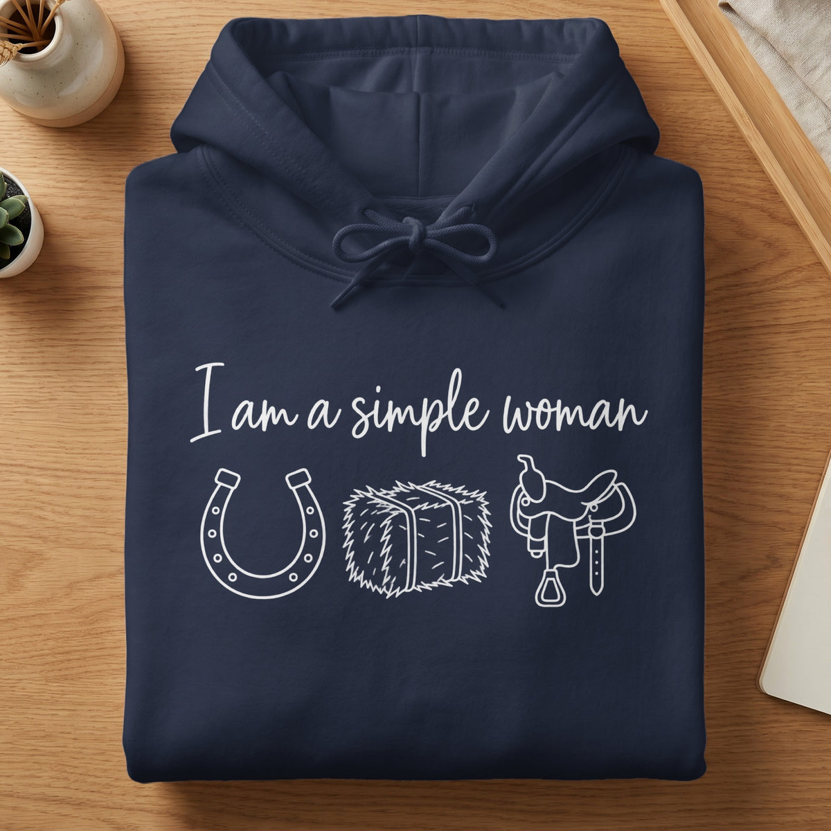 Navy hoodie with "I am a simple woman" and horseshoe, hay bale, saddle graphics.