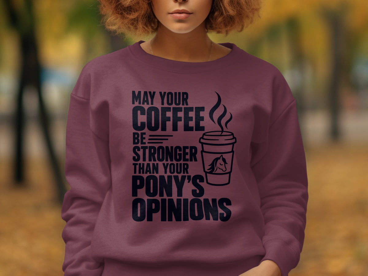 Maroon sweatshirt with "May your coffee be stronger than your pony's opinions" text.