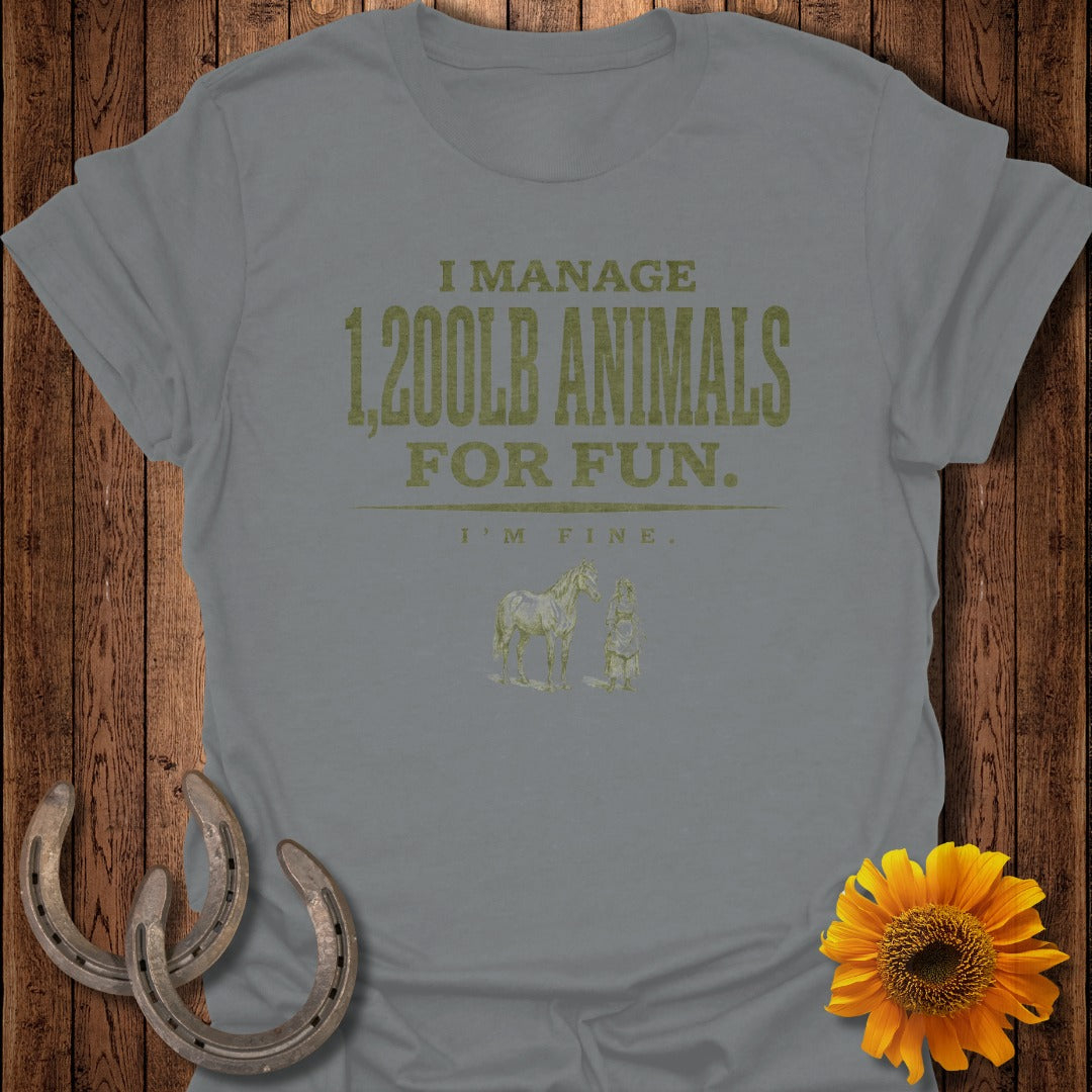 Gray t-shirt with gold text "I manage 1,200lb animals for fun. I'm fine."