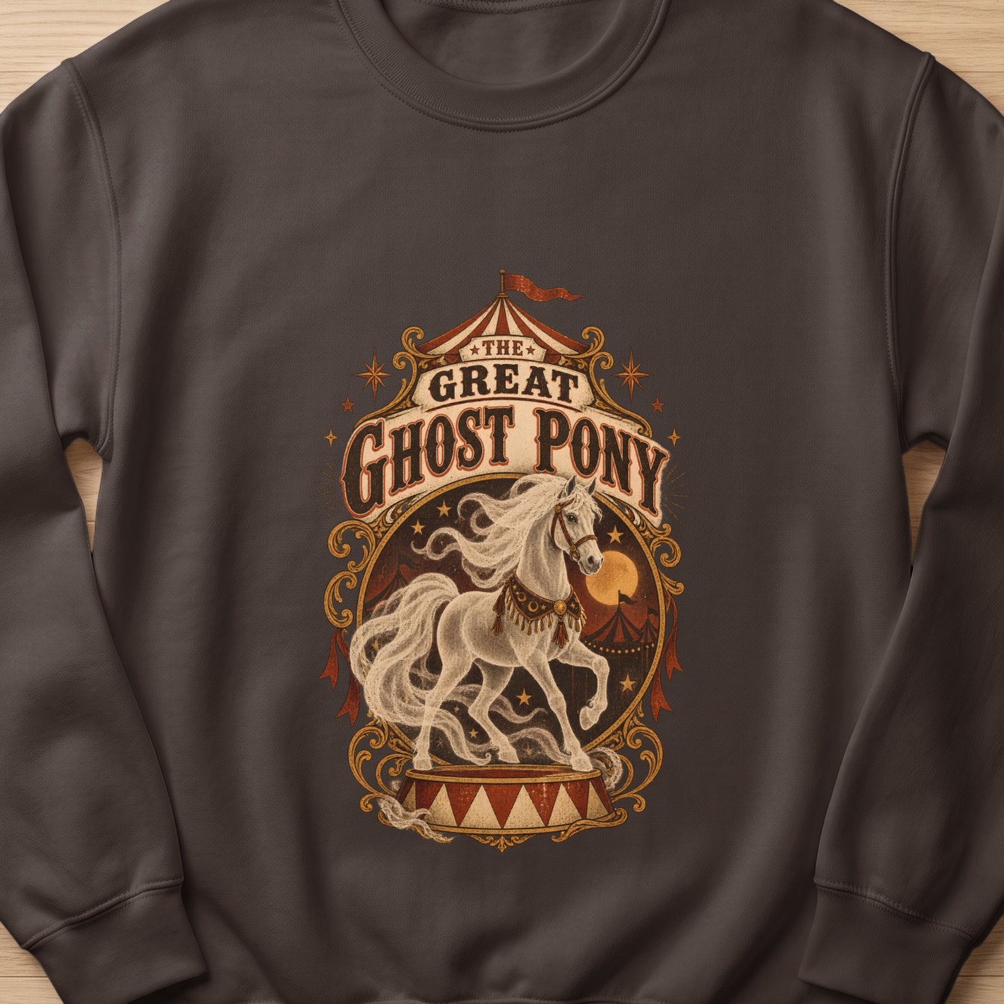 Ghost Pony circus graphic on a dark gray sweatshirt.