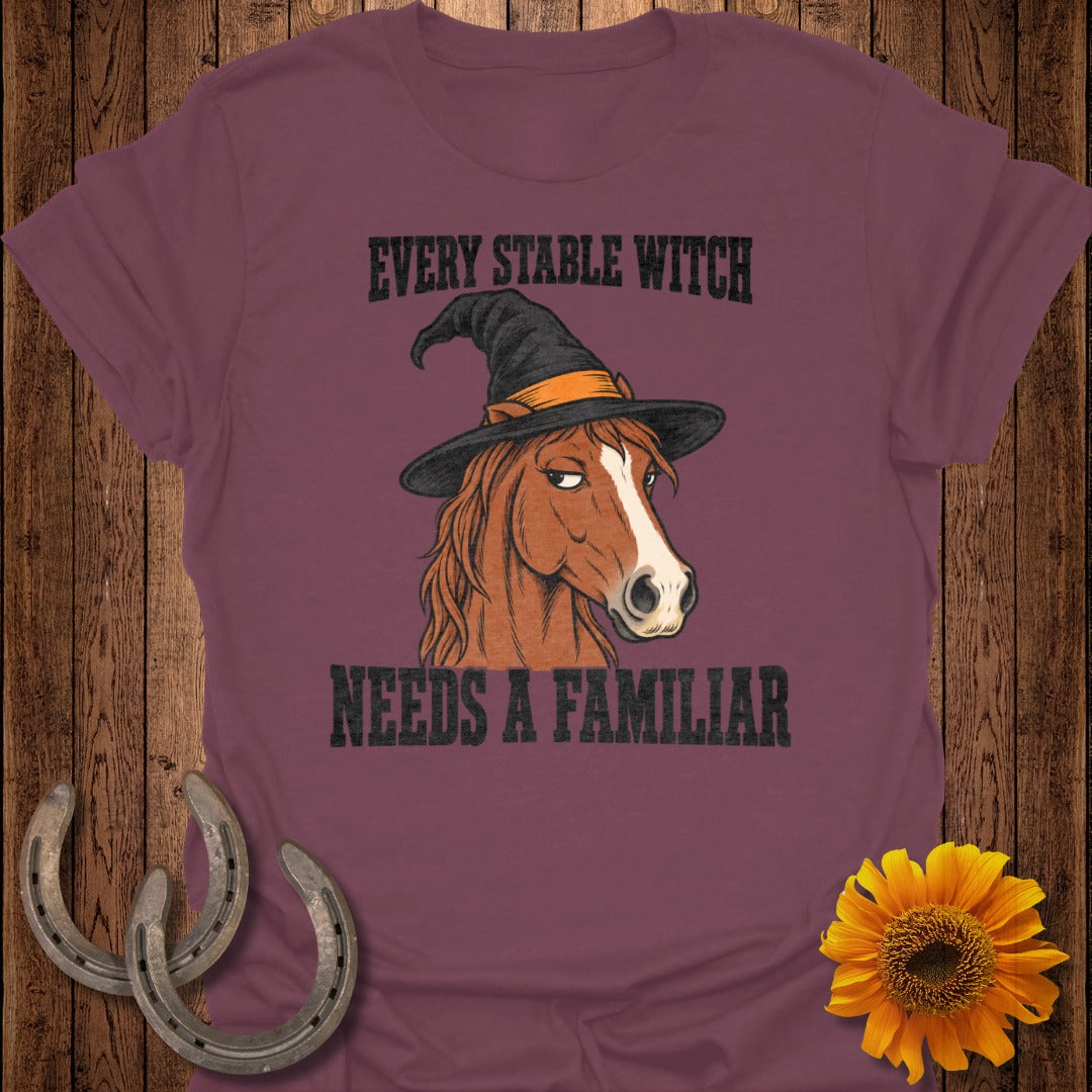 Brown horse wearing a witch hat with text "EVERY STABLE WITCH NEEDS A FAMILIAR".
