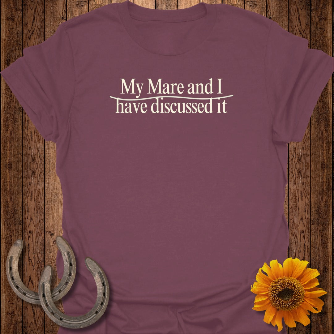 Maroon t-shirt with "My Mare and I have discussed it" text and horseshoes.