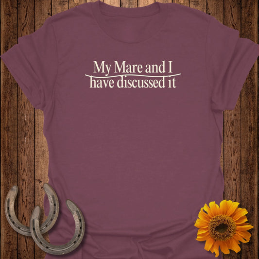 Maroon t-shirt with "My Mare and I have discussed it" text and horseshoes.