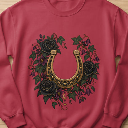 Red sweatshirt with a golden horseshoe and black roses floral design.