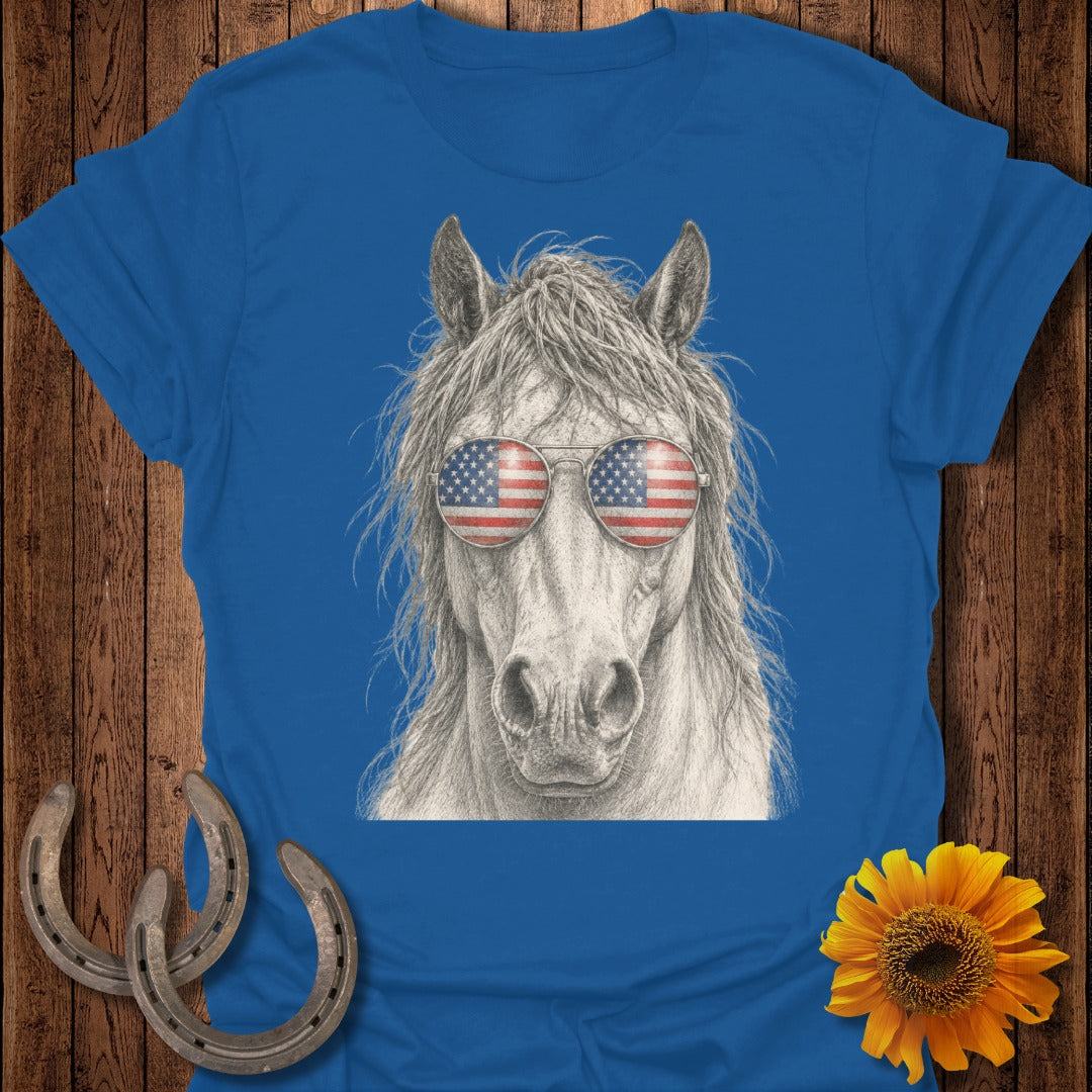 Horse wearing sunglasses with American flag design.