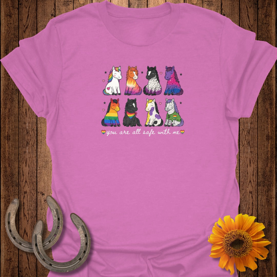 Pink t-shirt with a cartoon drawing of eight horses and the text "you are all safe with me".