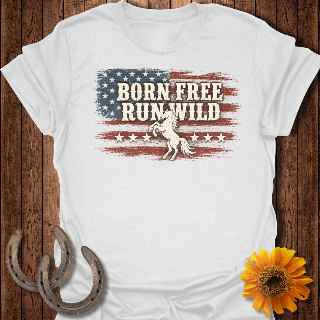 White t-shirt with "BORN FREE RUN WILD" text over distressed US flag and prancing horse.