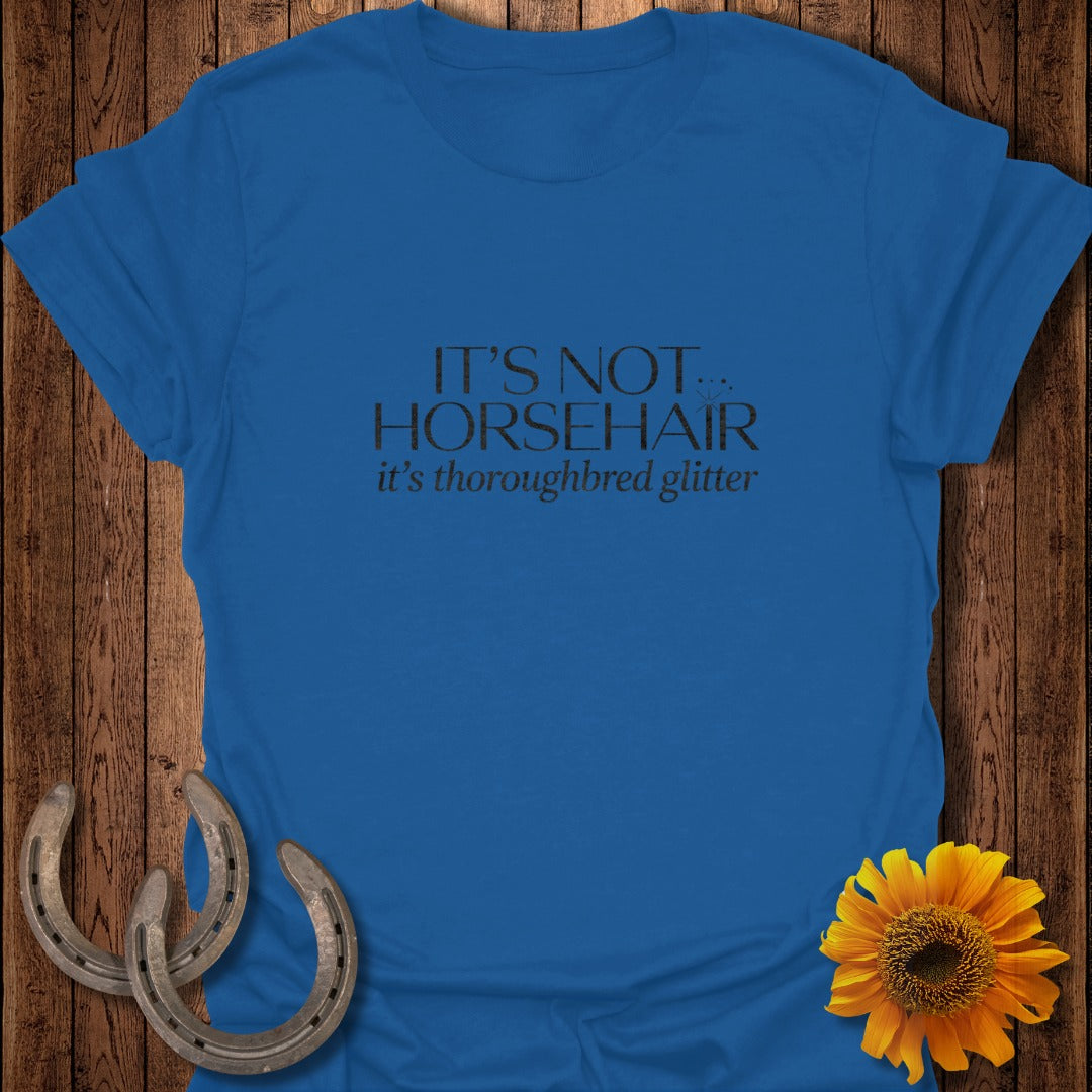 Royal blue t-shirt with "IT'S NOT thoroughbred glitter" text.