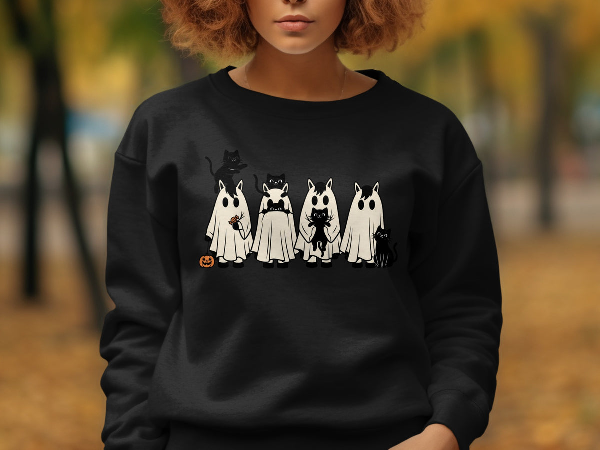 Black sweatshirt with a Halloween design of cats in ghost costumes and a pumpkin.