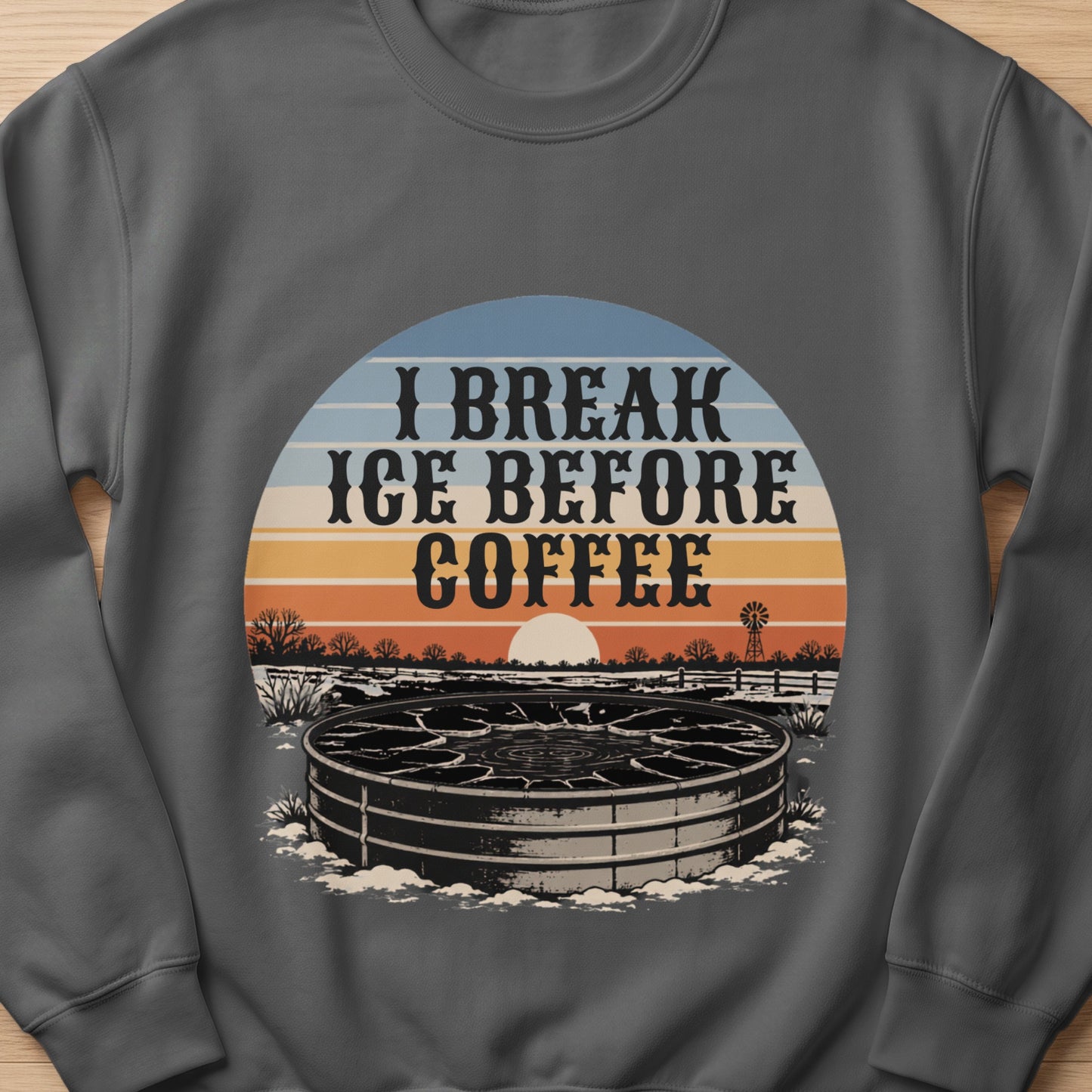 Text "I Break Ice Before Coffee" over a frosty water trough and rural sunset scene.