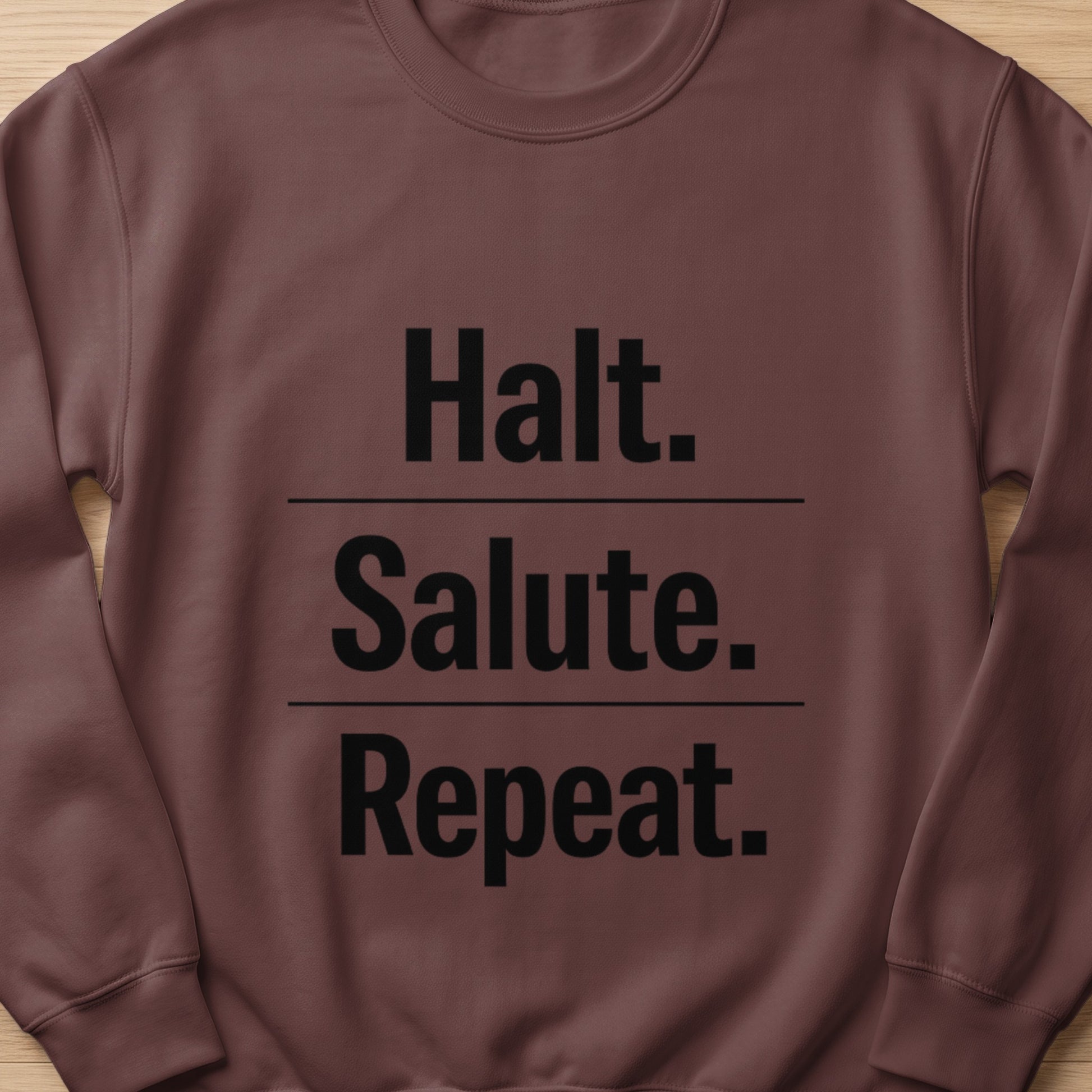 Brown sweatshirt with black text: Halt. Salute. Repeat.