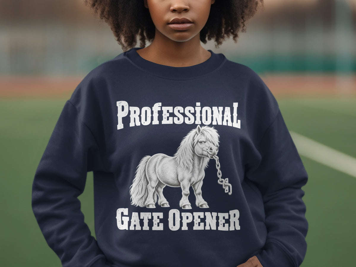 A person wearing a dark blue crewneck sweatshirt with white text reading "PROFESSIONAL GATE OPENER" and an illustration of a pony biting a chain.