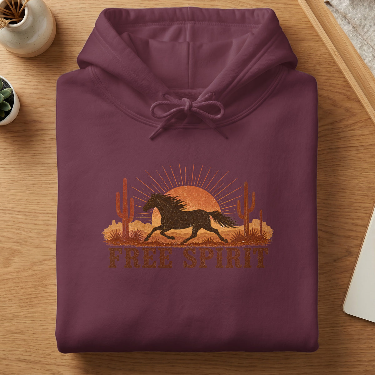 Maroon hoodie with desert horse graphic and text "Free Spirit".