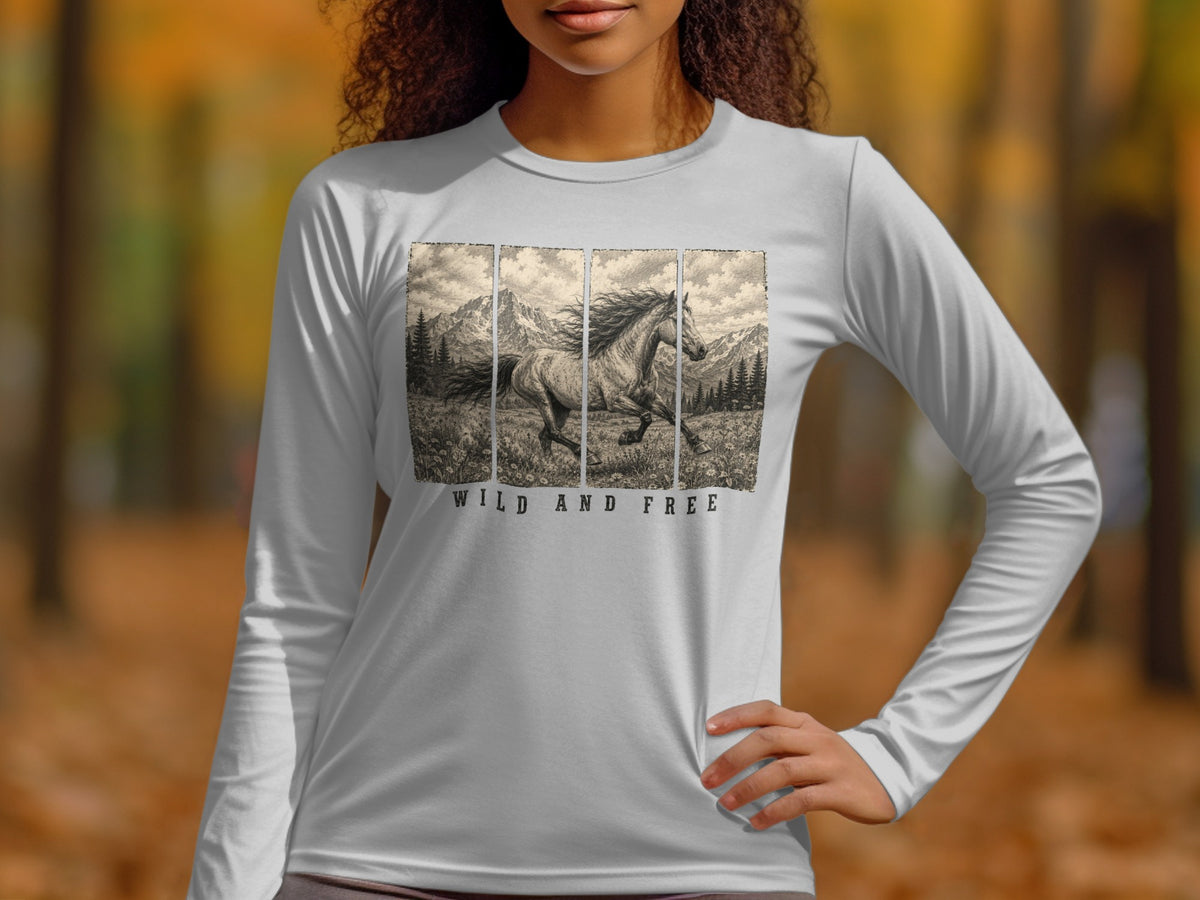 White long-sleeve shirt with a running horse and mountain scene, text "WILD AND FREE".