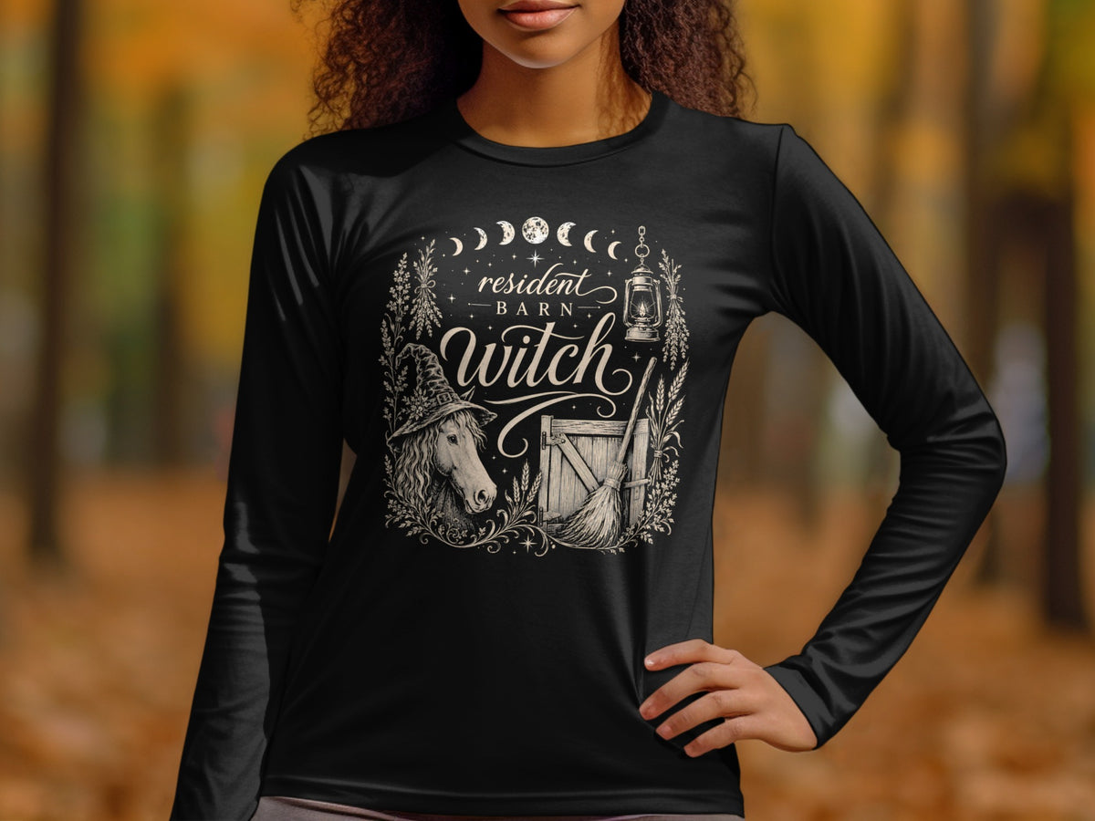 Black long-sleeve shirt with "resident BARN Witch" text, horse, and broom illustration.