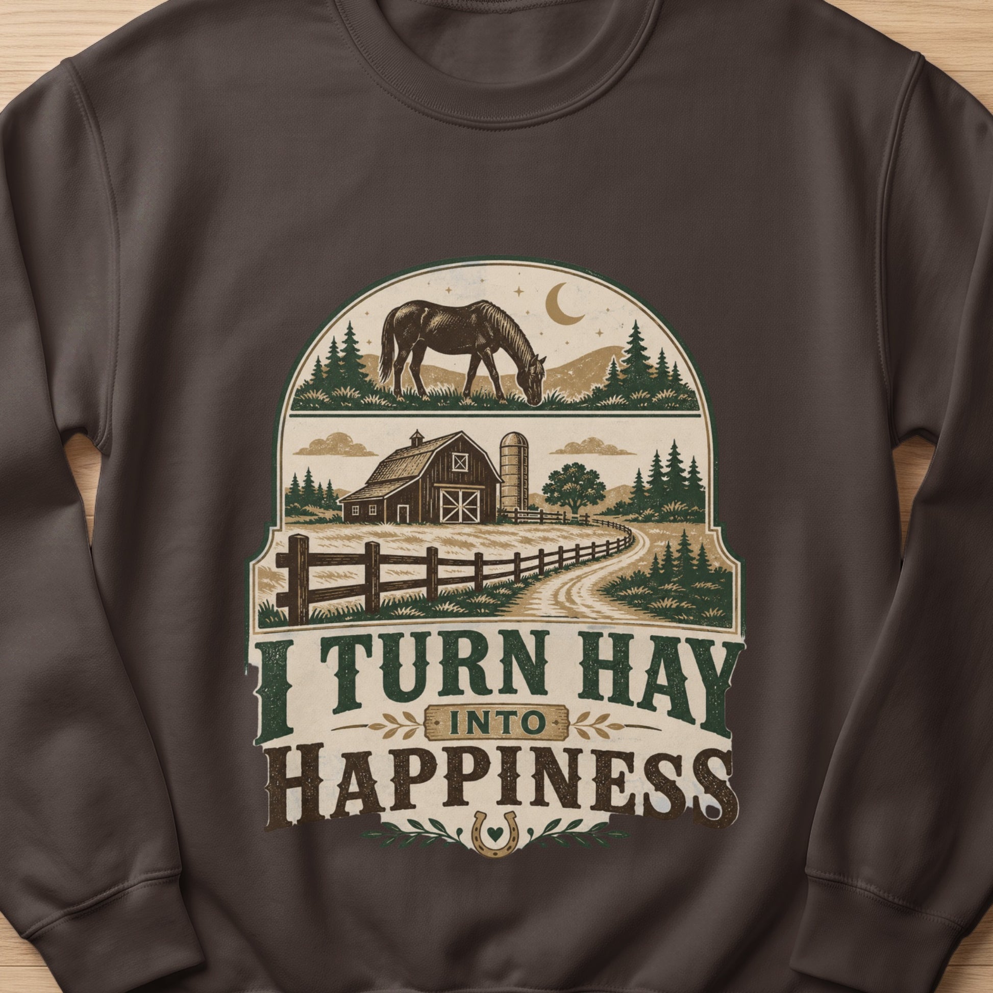 Brown sweatshirt featuring a farm scene with horse, barn, and text "I TURN HAY INTO HAPPINESS".