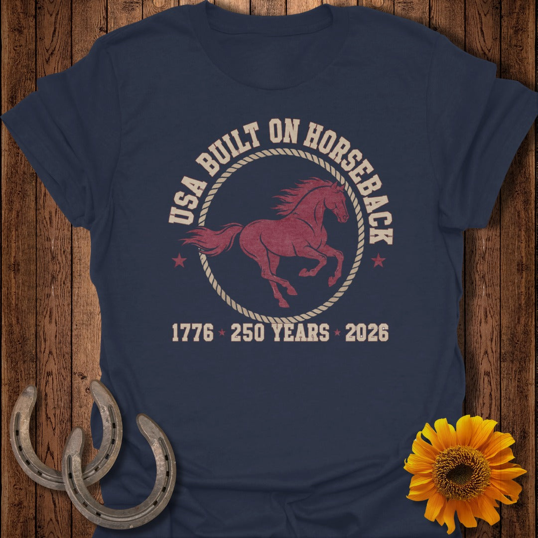 Navy t-shirt with "USA BUILT ON HORSEBACK" text and a galloping horse graphic.