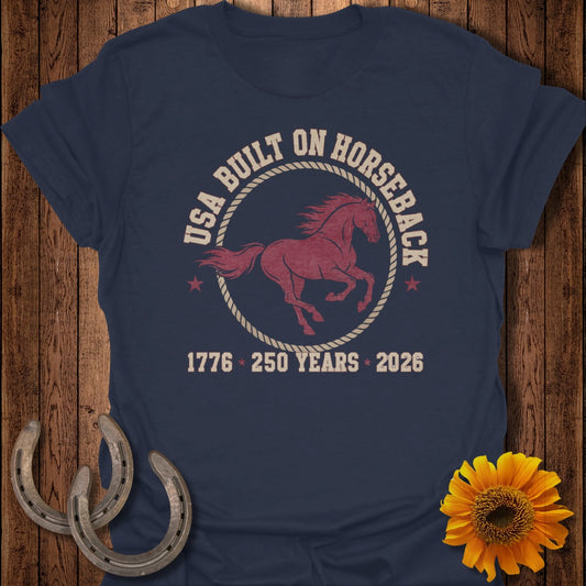 Navy t-shirt with "USA BUILT ON HORSEBACK" text and a galloping horse graphic.