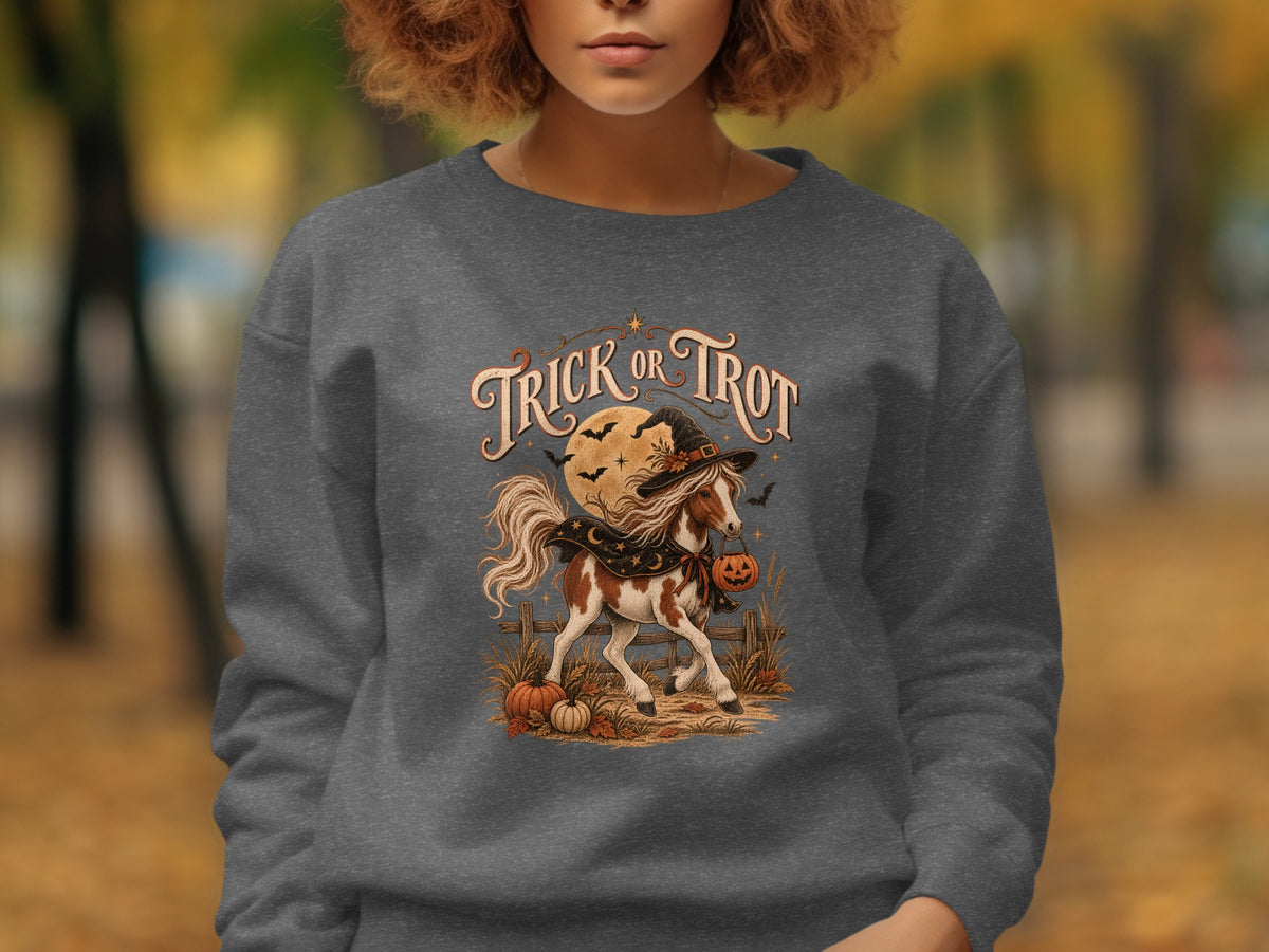 Horse wearing a witch hat and cape, carrying a pumpkin, with "Trick or Trot" text.