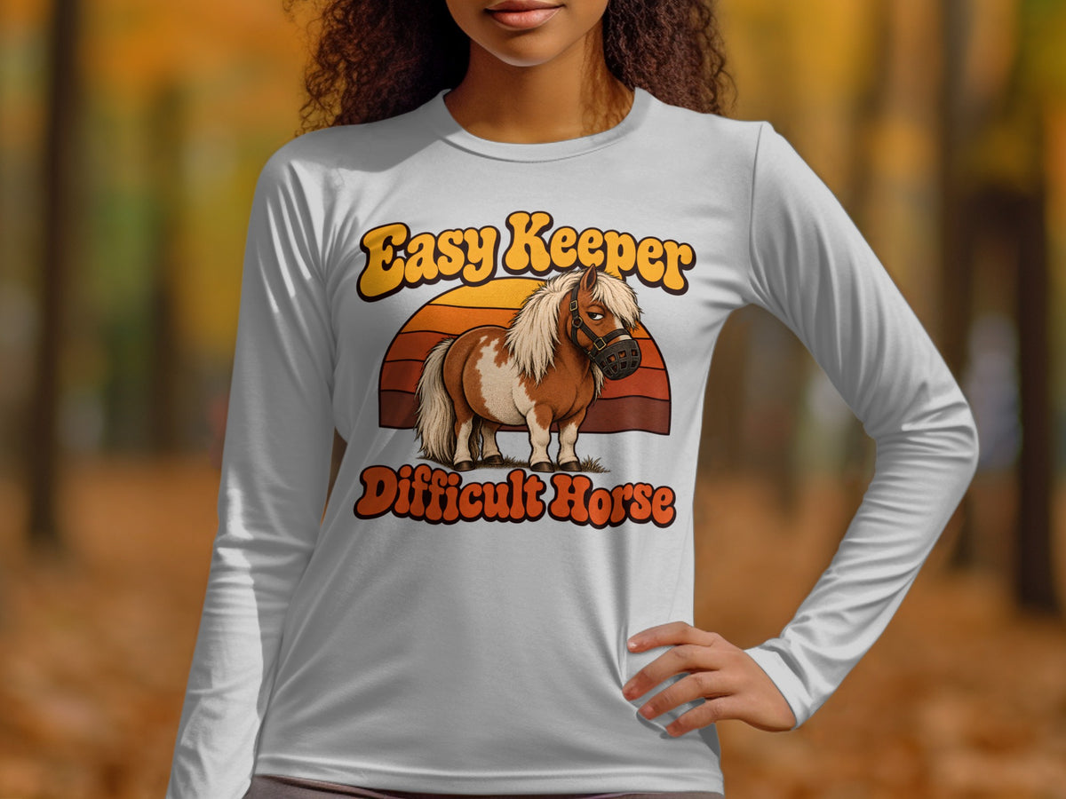 White long-sleeve shirt with "Easy Keeper Difficult Horse" text and a pony graphic.