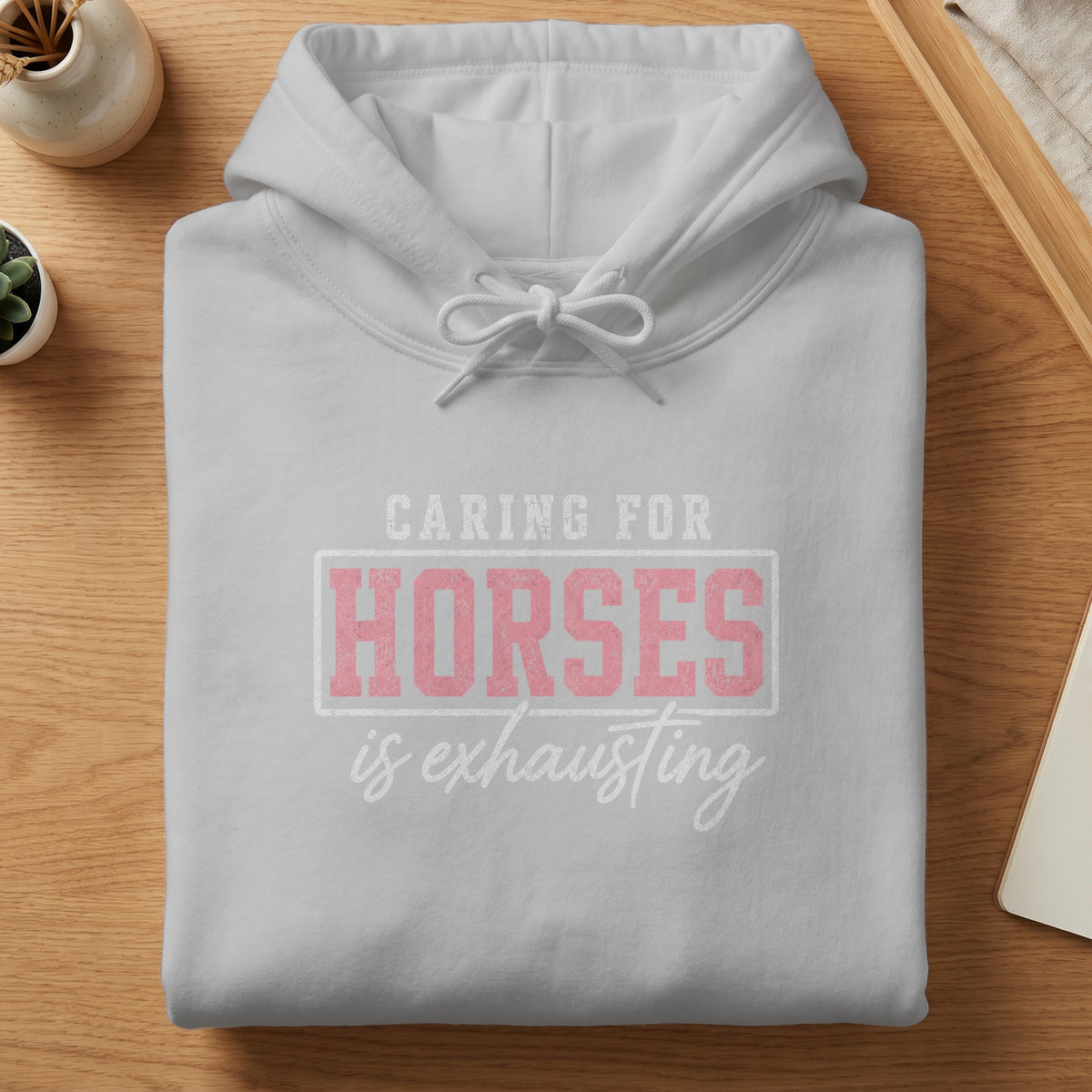Grey hoodie with "CARING FOR HORSES is exhausting" text graphic.