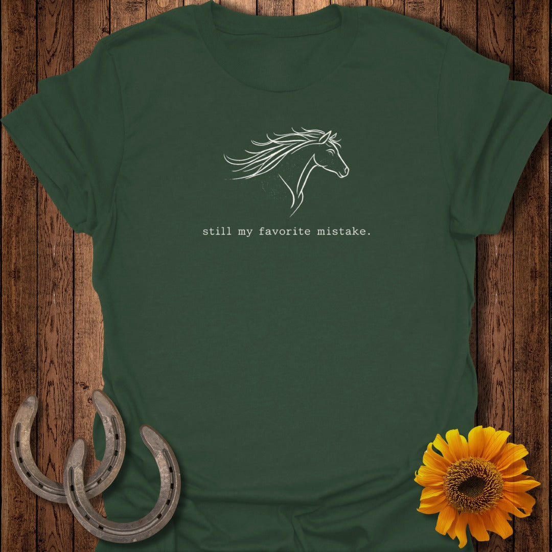 Green t-shirt with white horse outline and text "still my favorite mistake."