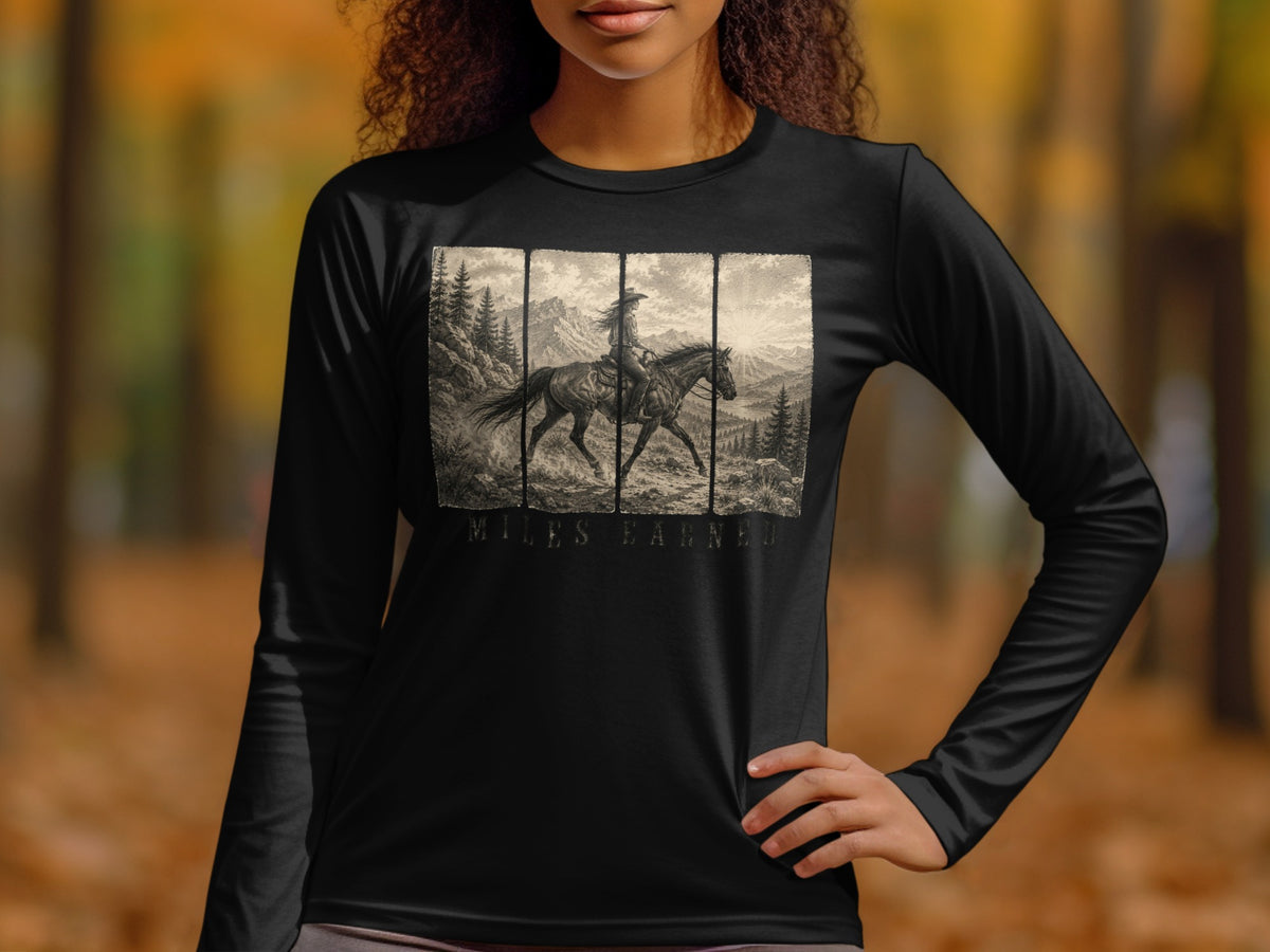 Black long-sleeve shirt with a vintage illustration of a rider on horseback in mountains.
