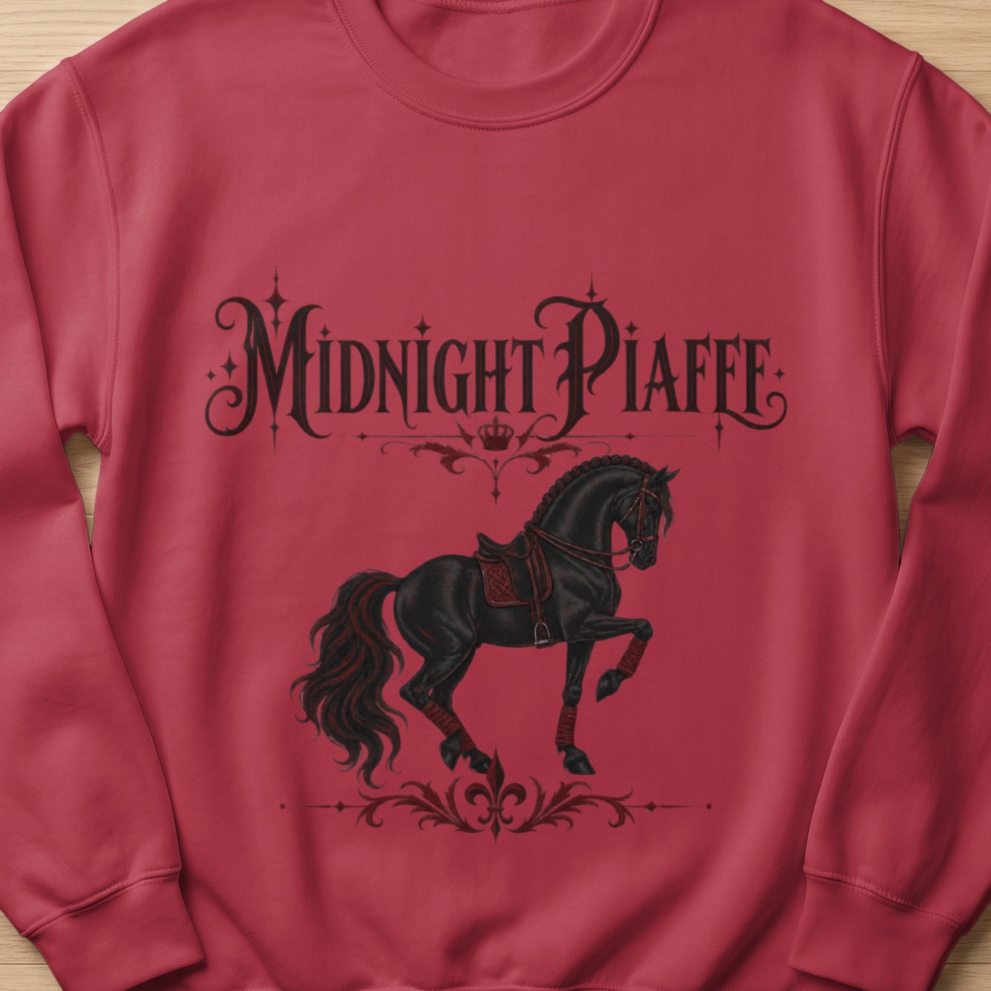 Red sweatshirt with black "Midnight Piaffe" text and a black horse graphic.