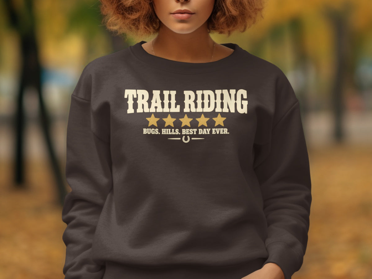 Dark brown sweatshirt with "Trail Riding" text and a horseshoe graphic.