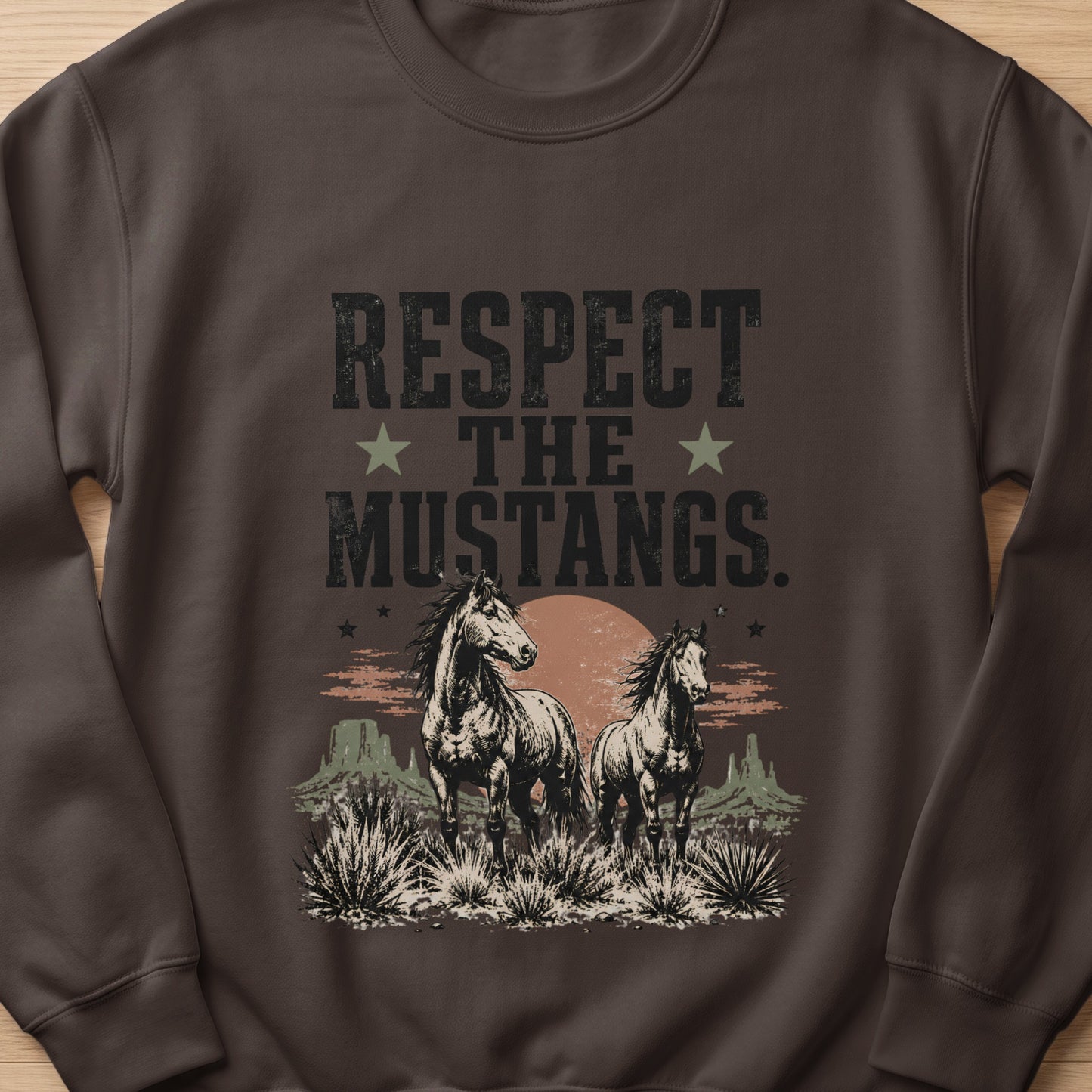 Brown sweatshirt with "RESPECT THE MUSTANGS" text and two horses in a desert landscape.