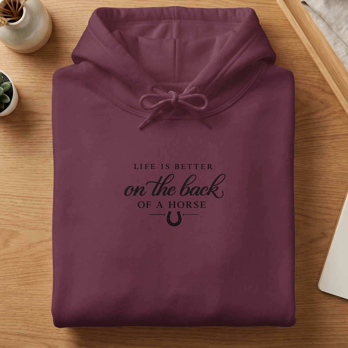 Maroon hoodie with "Life is better on the back of a horse" text.