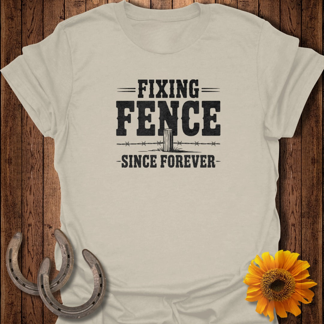 T-shirt with "Fixing Fence Since Forever" text and barbed wire design.