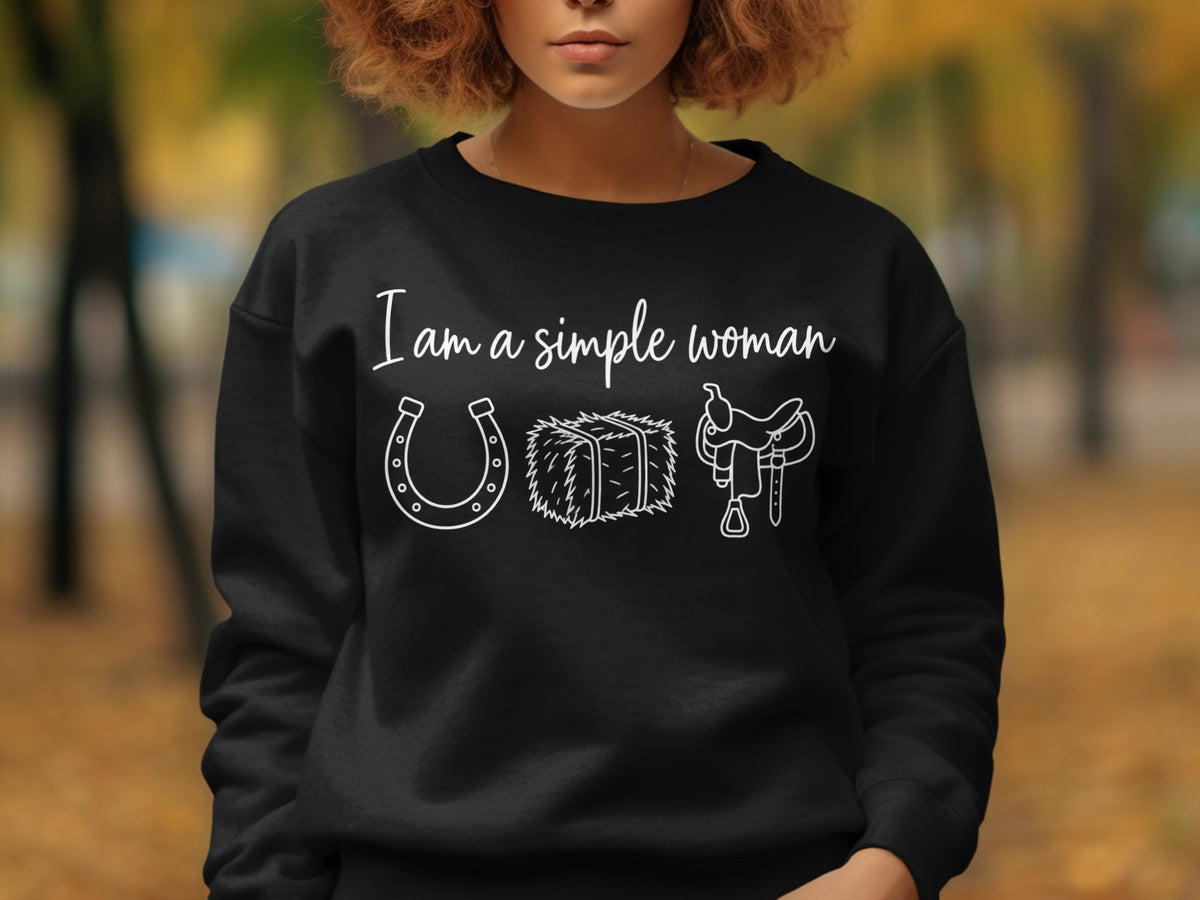 Black sweatshirt with "I am a simple woman" text and horse-themed icons.