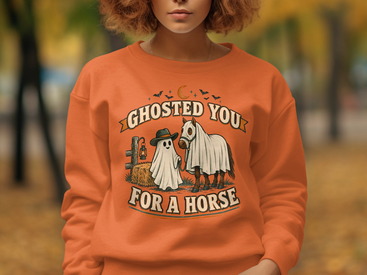 Orange sweatshirt with "Ghosted You For a Horse" graphic featuring a ghost and a horse.
