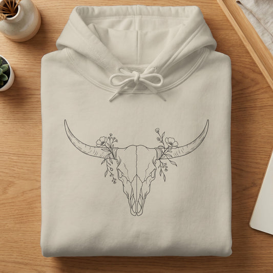 Cream hoodie with a line drawing of a bull skull with flowers.