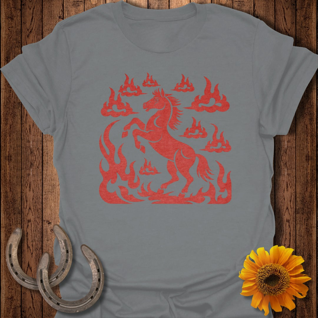 Red horse silhouette amidst flames, with horseshoes and sunflower nearby.