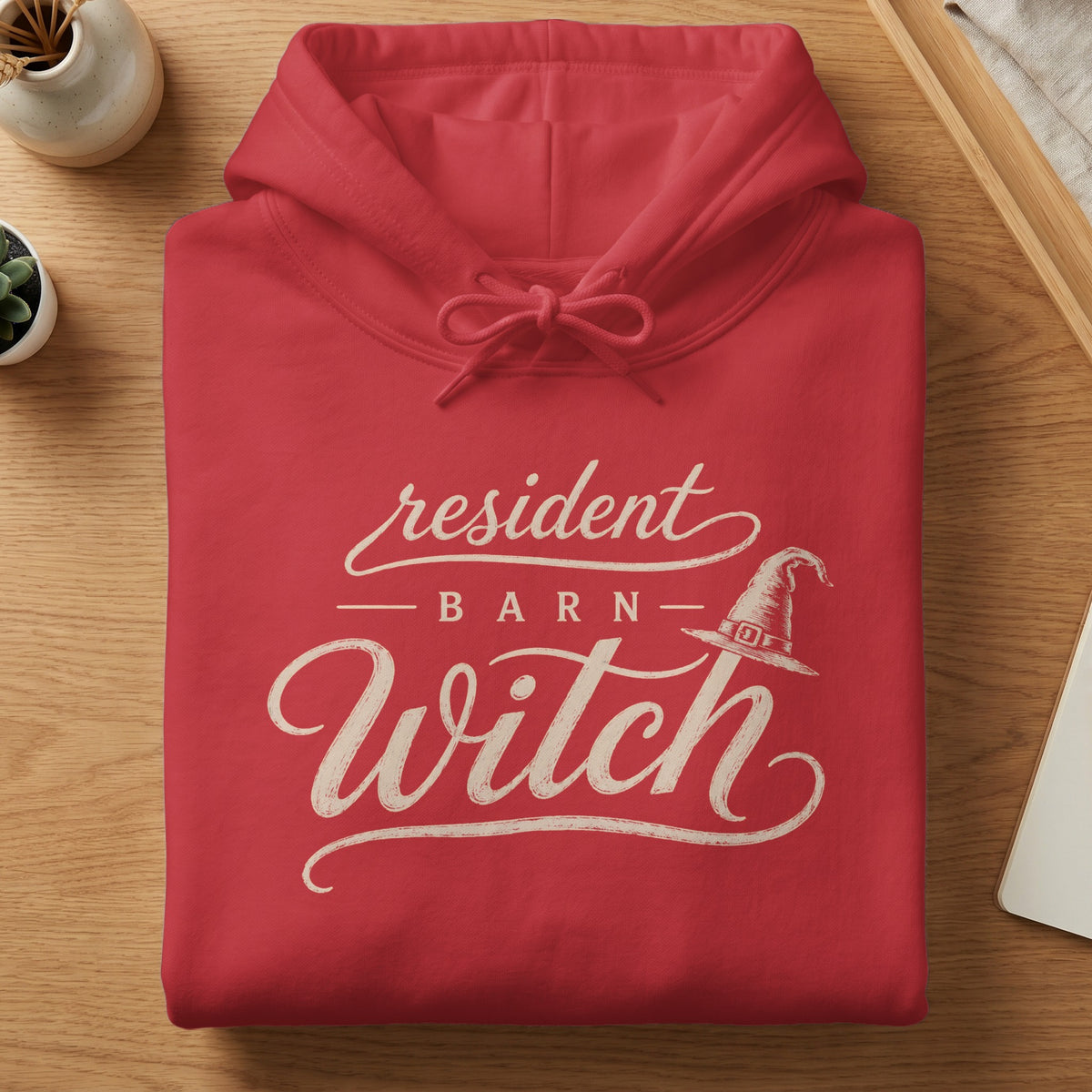Red hoodie with "resident BARN Witch" text and a witch hat graphic.