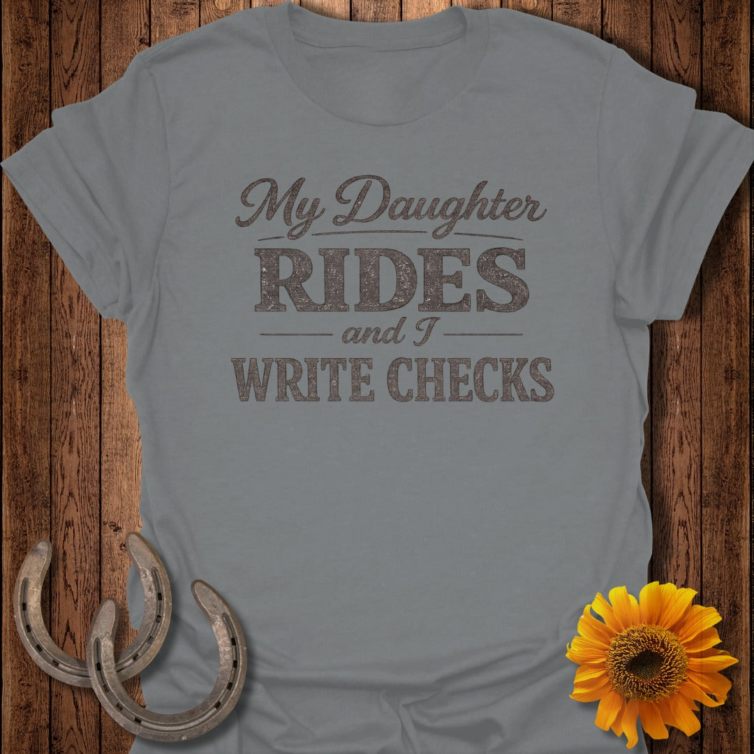 Gray t-shirt with "My Daughter Rides and I Write Checks" text, horseshoes, and sunflower.
