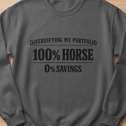 Dark gray sweatshirt with text "Diversifying my portfolio 100% horse 0% savings".