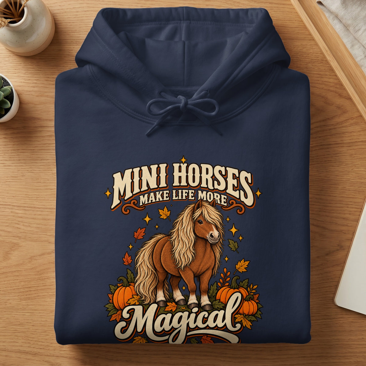 Navy hoodie with "Mini Horses Make Life More Magical" text and autumn-themed horse graphic.