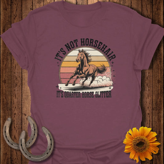 T-shirt with "It's not horsehair, it's quarter horse glitter" text and a running horse.