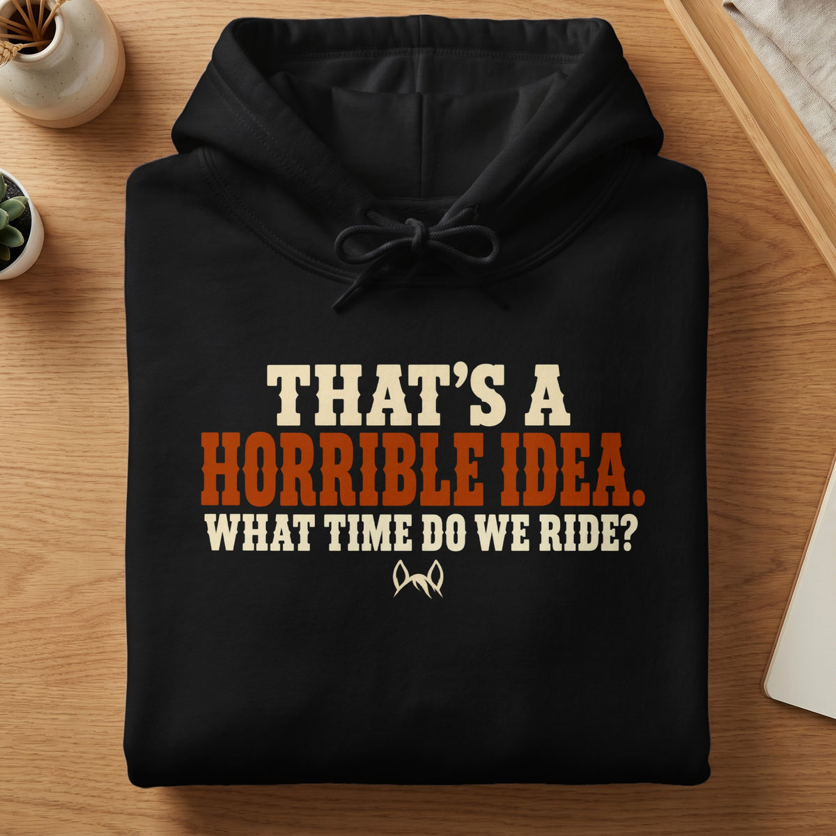Black hoodie with text that reads "That's a horrible idea. What time do we ride?"