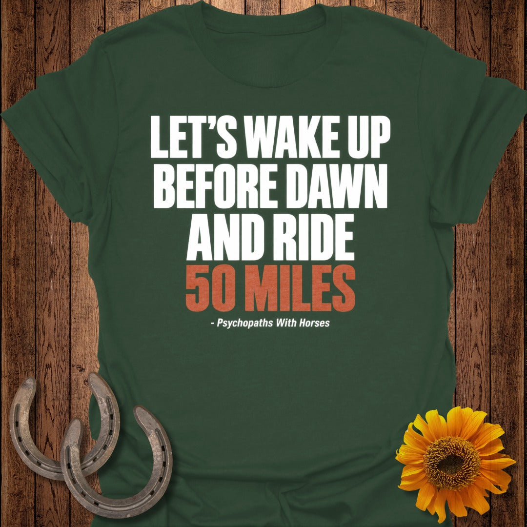 Green t-shirt with white text "LET'S WAKE UP BEFORE DAWN AND RIDE 50 MILES".