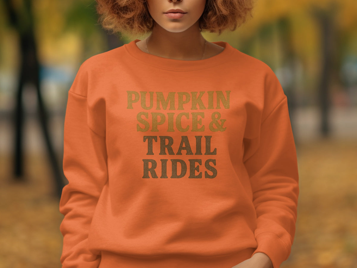 Orange sweatshirt with "PUMPKIN SPICE & TRAIL RIDES" text.