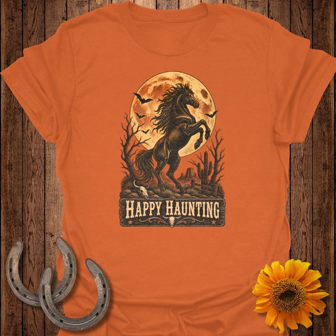 Orange t-shirt with a spooky horse design and "Happy Haunting" text.