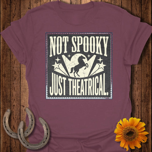 Maroon t-shirt with "Not Spooky Just Theatrical" text and a horse silhouette.