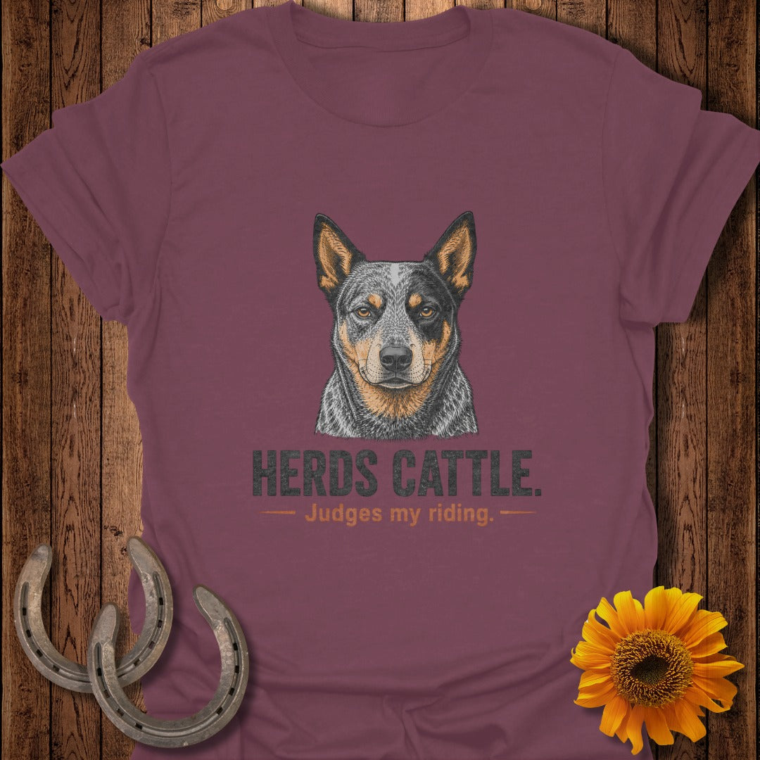 Maroon t-shirt with an Australian Cattle Dog graphic and text "HERDS CATTLE. Judges my riding."