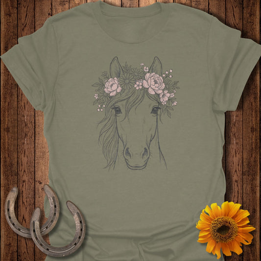 Horse head with floral crown, flanked by horseshoes and a sunflower.